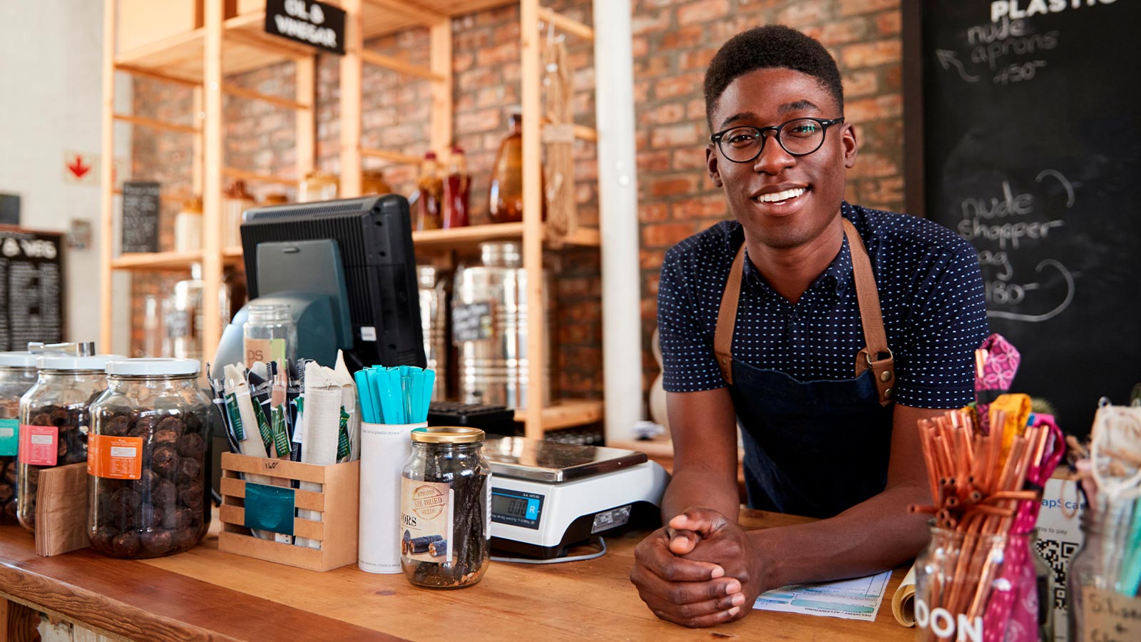 Smiling men at his natural store